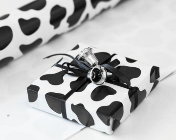 BLACK AND WHITE COW PRINT GIFT WRAPPING PAPER